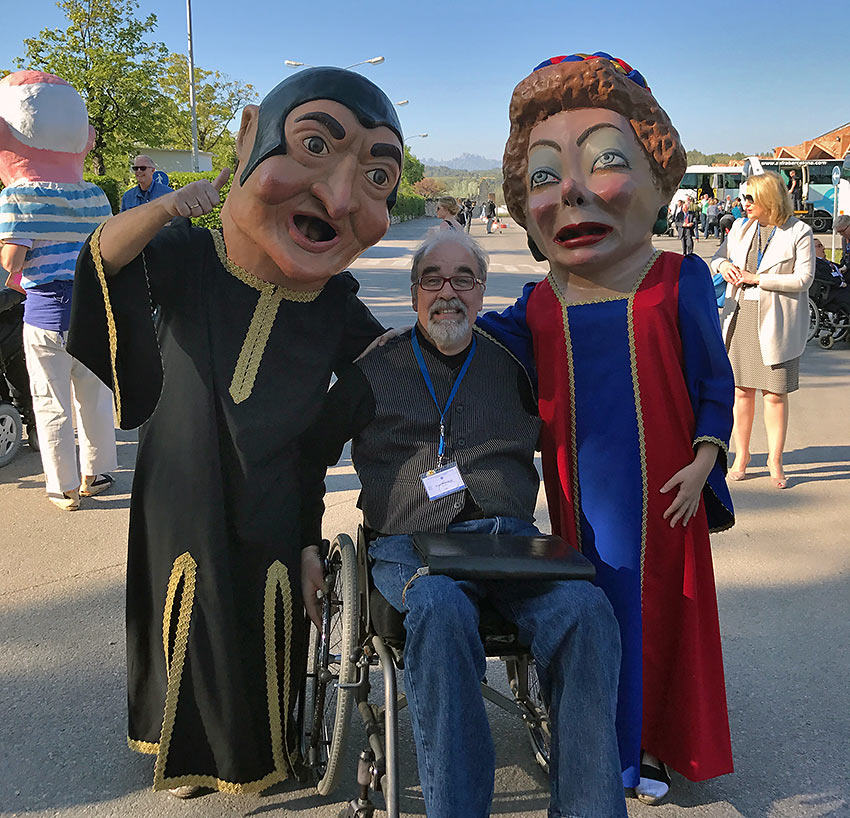 the writer with paper mache puppets in Spain