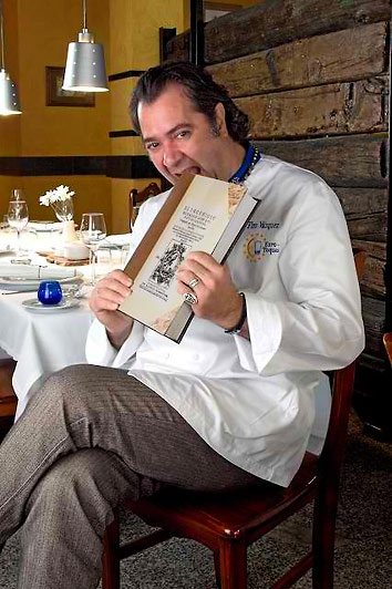 Chef Firo Vazquez de Parga of El Olivar restaurant with one of his edible books