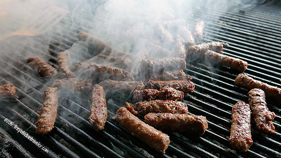 meat grilling on charcoal