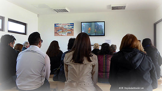 visitors at a screening room at the Tunnel of Hope Museum
