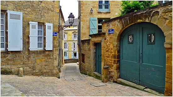 arch door at one of Sarlat-la-Caneda's restored medieval stone buildings