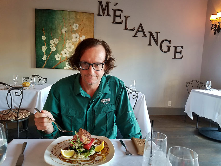 the writer enjoying a dish at the Melange
