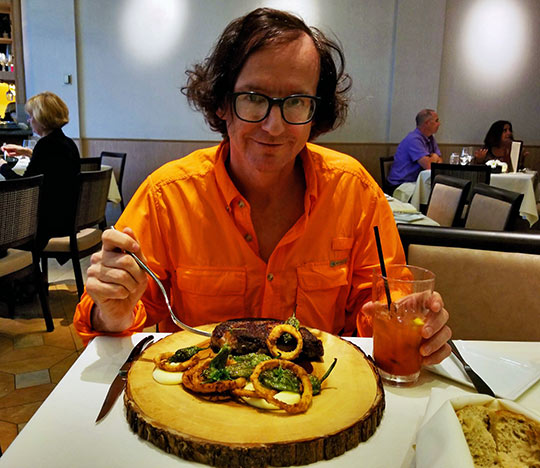 writer sampling Nine-Ten's 40-day aged prime rib-eye steak