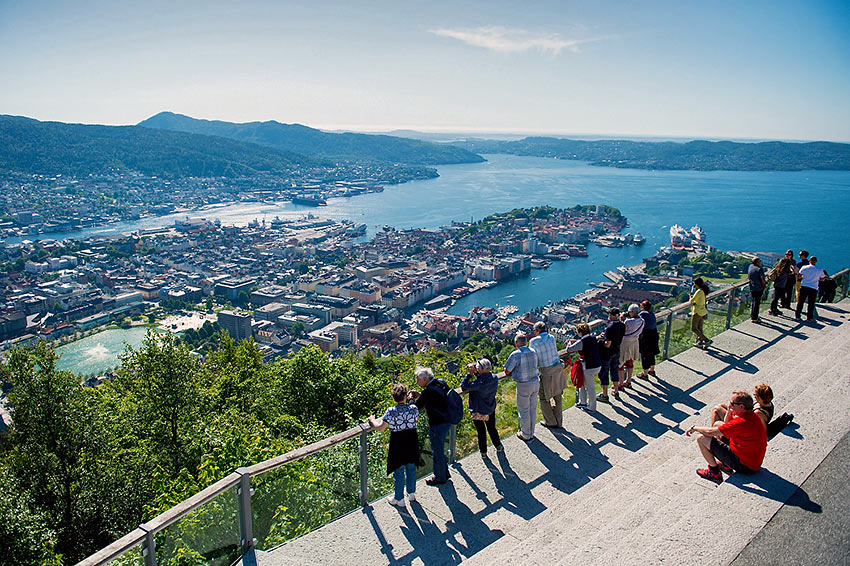 visitors enjoying a view of Bergen from a vantage point