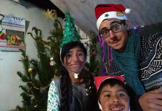 writer with host family siblings on Christmas