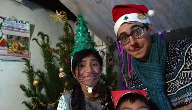 writer with host family siblings on Christmas