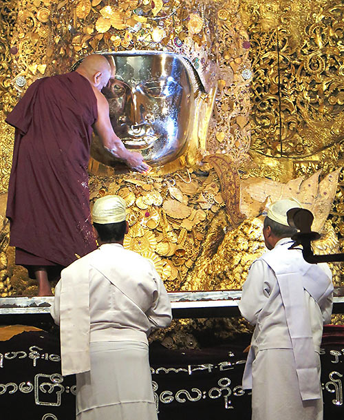 daily cleansing ritual at Maha Muni Pagoda, Mandalay, Myanmar