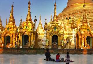Burmese praying at pagoda