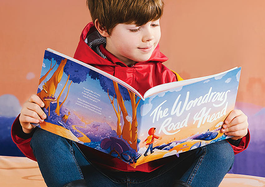 child with Wonderbly’s 'The Wonderous Road Ahead'
