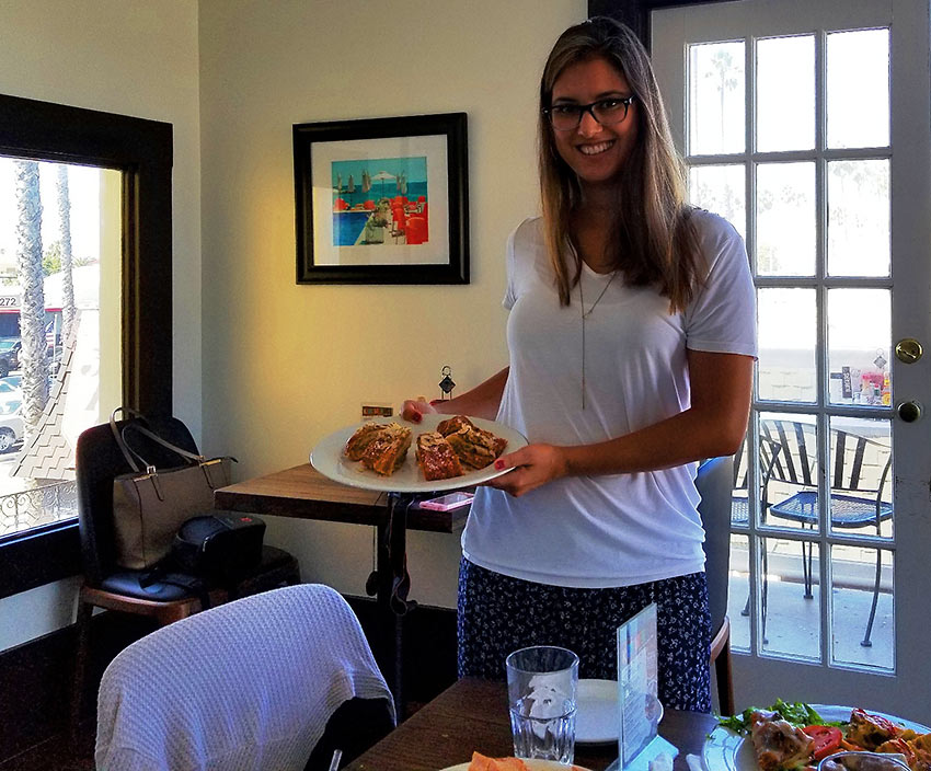 staff at Saint Tropez Bistro welcoming guests