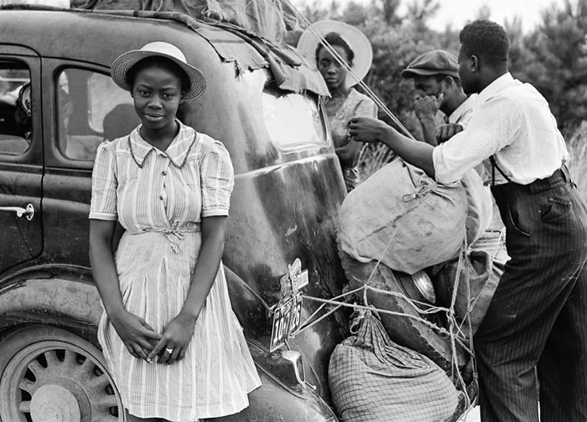 Group of Florida migrants on their way to Cranberry, New Jersey, to pick potatoes. Near Shawboro, North Carolina, July 1940