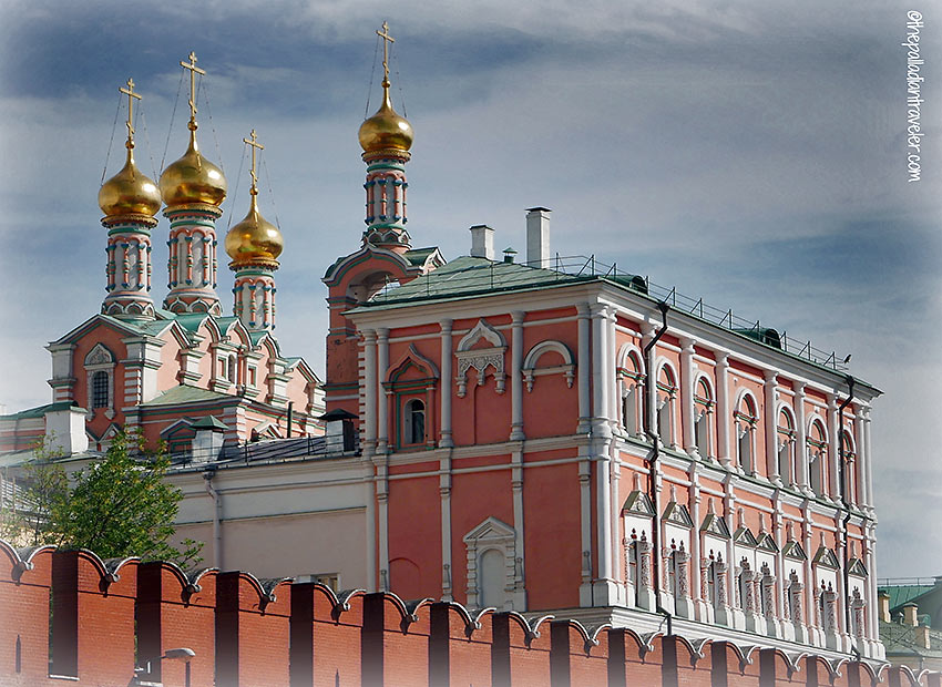 view of the Virgin Church and its four gilded domes behind the Kremlin's walls
