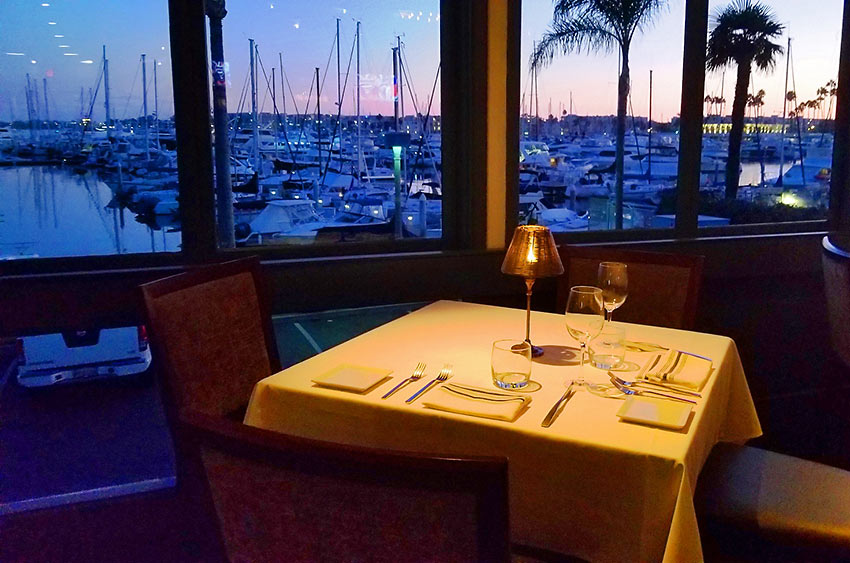 table at Cafe del Rey with the harbor in the background