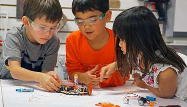 kids with Tinkering Labs set