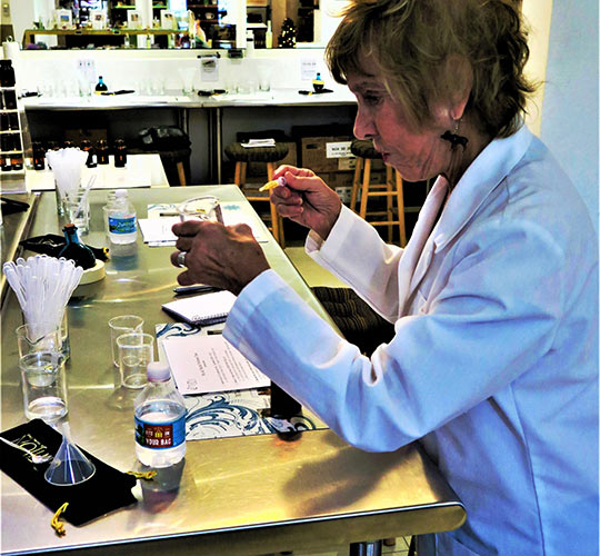 writer creating perfume from scratch at The Parfumerie