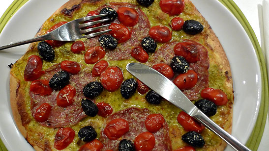 finished flatbread pizza on a plate