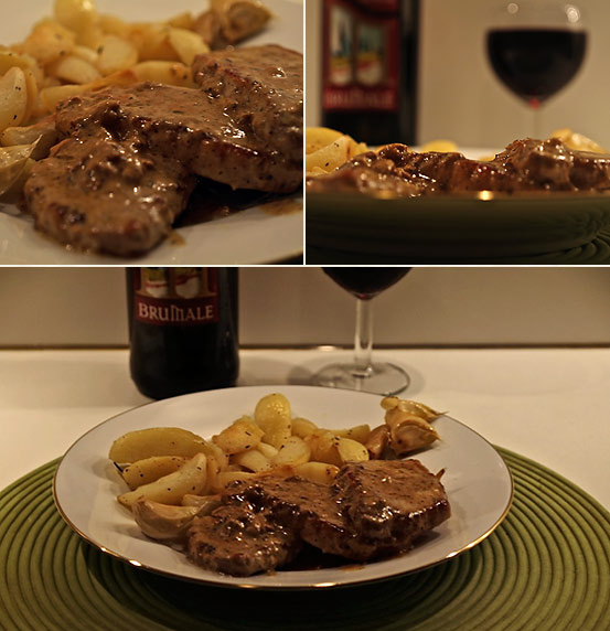 finished pan-seared plum brandy pork loiin chops with rosemary potatoes and garlic